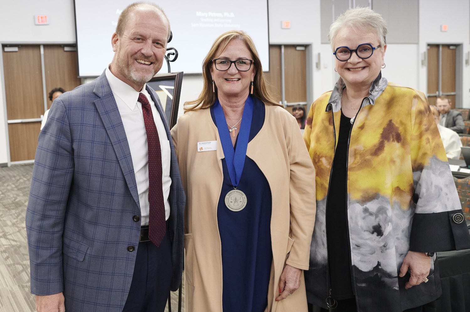 From left: Regent Stephen Lee, Andrea Foster and University President Alisa White